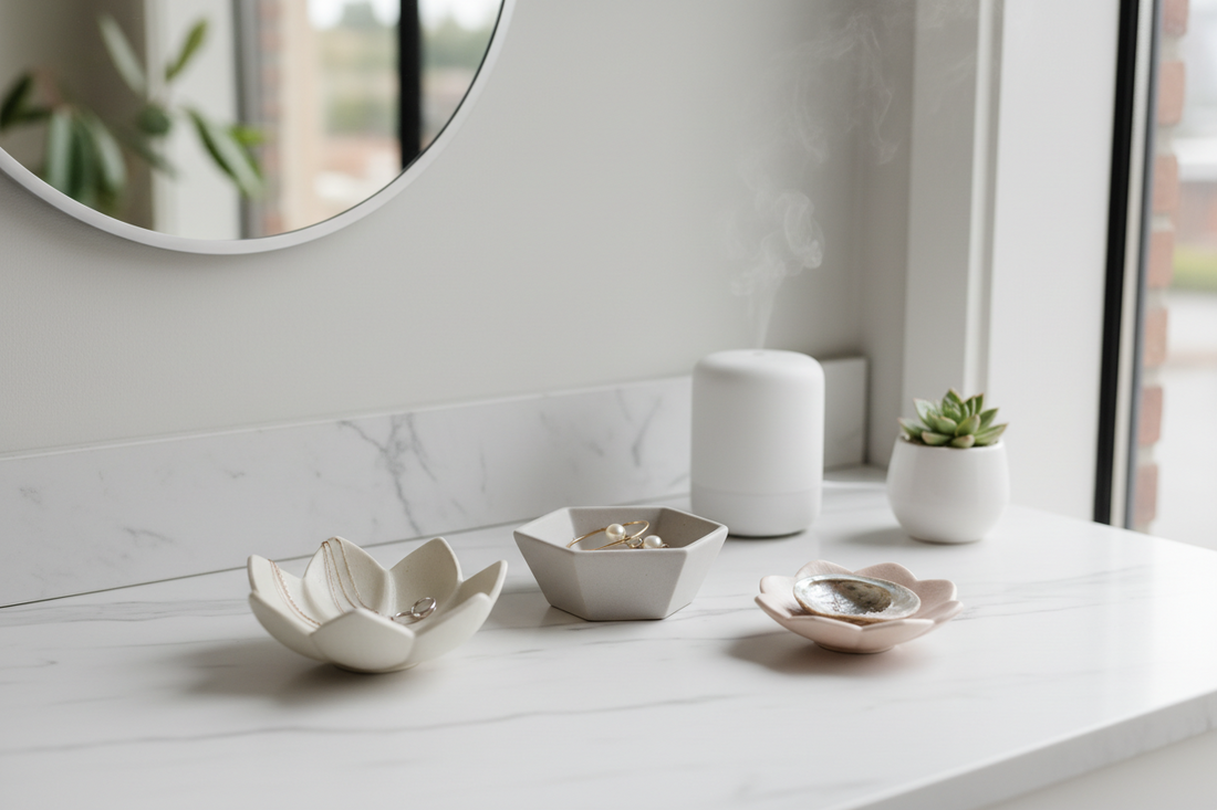 A professional home sanctuary setup featuring jewelry dishes, scent candle, and cotton waffle knit throws, by Fit-Flow.