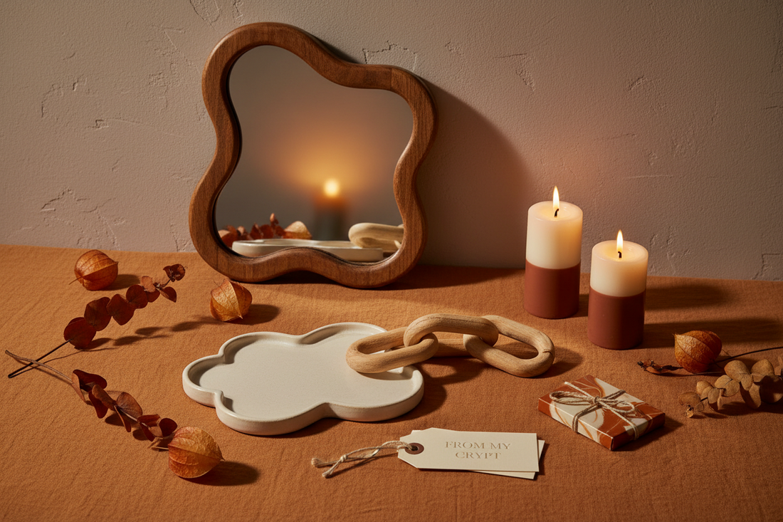 Elegant Halloween gift ideas for home decor lovers including a ceramic cloud tray, wood sculpture, and wavy mirror styled for fall 2026