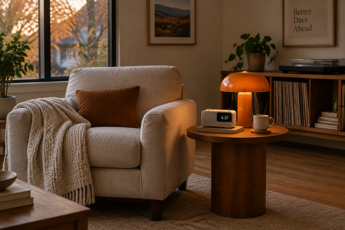 Cozy fall music corner with a white clock radio, orange mushroom lamp, and cotton waffle throw.
