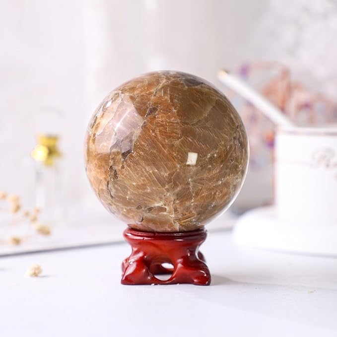 Nupuyai Natural Orange Moonstone Crystal Ball with Resin Stand, Healing Crystal Sphere for Home Decor 2.4"-2.76"(61mm-70mm)