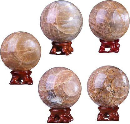 SUNYIK Natural Orange Moonstone Ball Sphere with Resin Stand Polished Crystal Sphere Stone Figurine Decor for Home Office Tabletop, 2.8-3.1”(71-80mm)