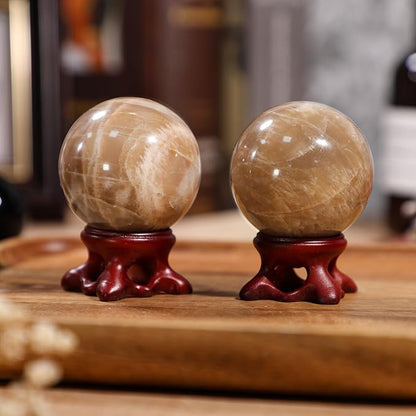 moonsix Natural Orange Moonstone Crystal Sphere with Resin Stand Healing Energy Stone Decorative Ball Sculpture for Home Office Tabletop, 41-50 mm