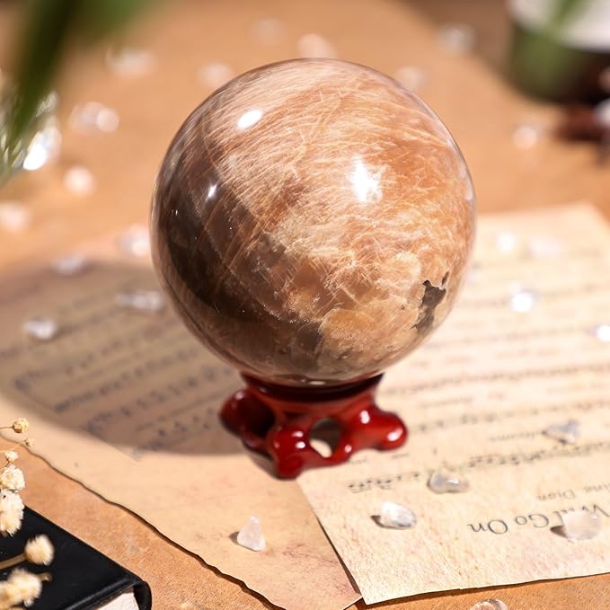 SUNYIK Natural Orange Moonstone Ball Sphere with Resin Stand Polished Crystal Sphere Stone Figurine Decor for Home Office Tabletop, 2.8-3.1”(71-80mm)