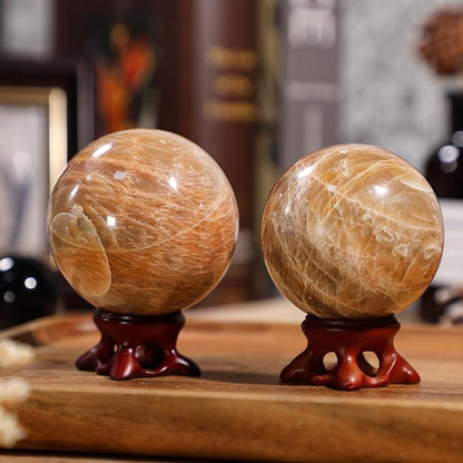 moonsix Natural Orange Moonstone Crystal Sphere with Resin Stand Healing Energy Stone Decorative Ball Sculpture for Home Office Tabletop, 51-60 mm