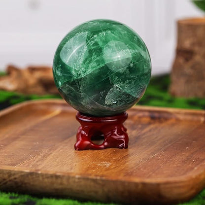 SUNYIK Natural Fluorite Ball Sphere with Resin Stand Polished Crystal Sphere Stone Figurine Decor for Home Office Tabletop, 2.4-2.7”(61-70mm)