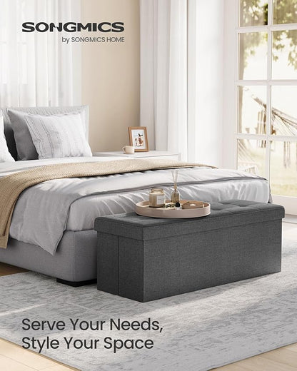 SONGMICS MAZIE Collection - 43 Inches Folding Storage Ottoman Bench, Ottoman Foot Rest, End of Bed Bench, Storage Chest, Load 660 lb, for Living Room, Bedroom, Entryway, Dark Gray ULSF77K