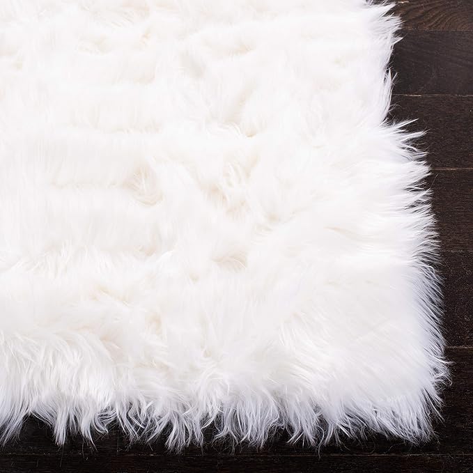 SAFAVIEH Faux Sheep Skin Collection Accent Rug - 2'6" x 4', Ivory, Silken Glam Design, Non-Shedding & Easy Care, 2.35-inch Thick Ideal for High Traffic Areas in Foyer, Living Room, Bedroom (FSS235A)