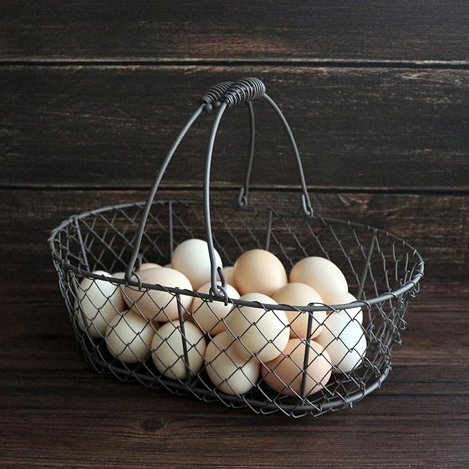 CVHOMEDECO. Oval Metal Wire Egg Basket Wire Fruit Basket with Handle Primitives Vintage Style Storage Basket. Rusty, 11 X 7-1/4 X 3-1/2 Inch