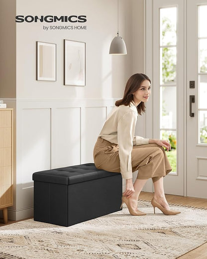 SONGMICS MAZIE Collection - 30 Inches Folding Storage Ottoman Bench, Ottoman with Storage, Foot Rest Stool, Load 660 lb, for Living Room, Synthetic Leather, Black ULSF105
